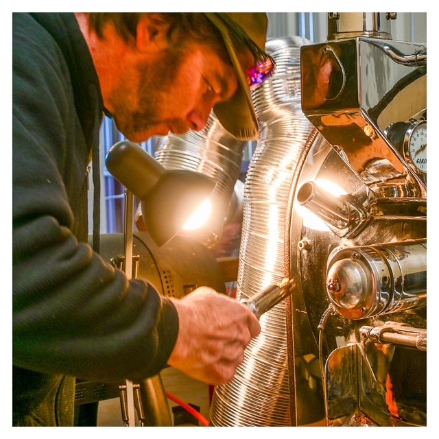 Founder roasting coffee at Derelict Coffee Roasters in New Zealand